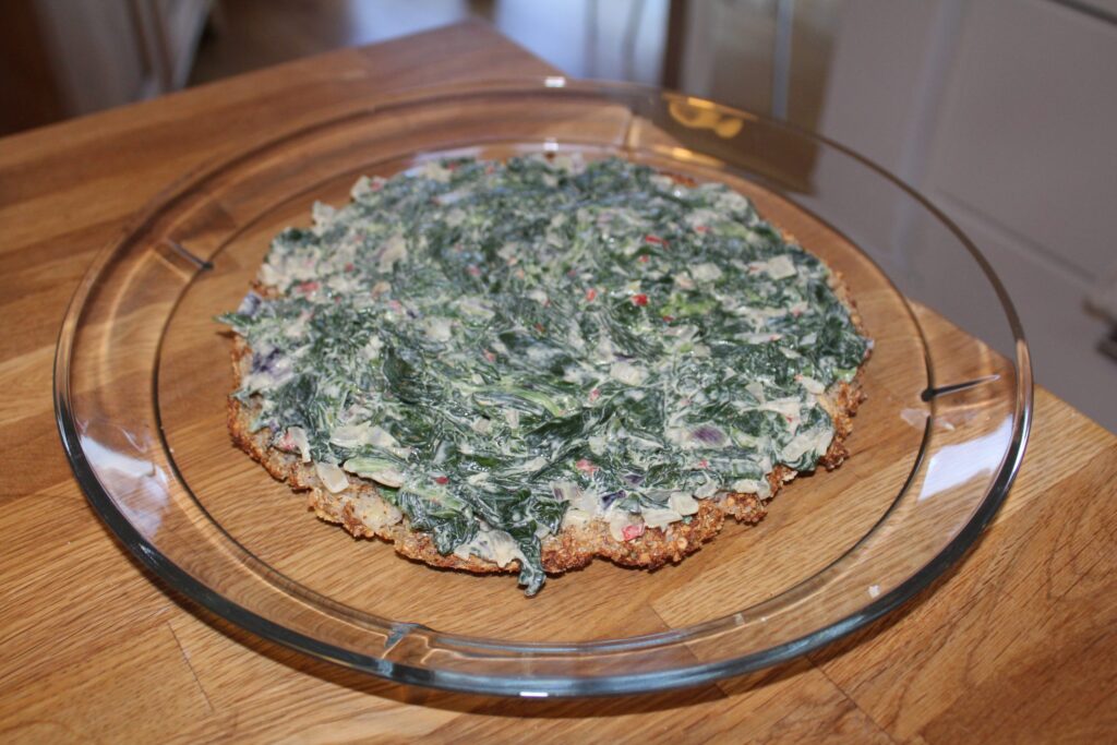 Spinatstuvning som lagtærtefyld